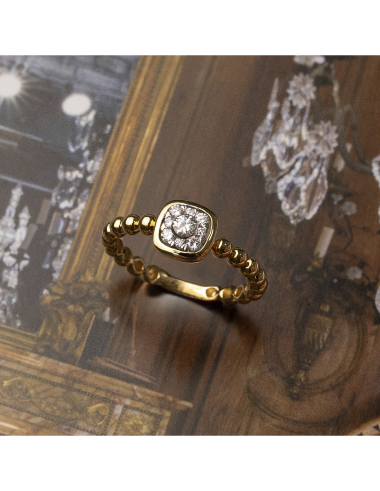 Gold ring with square diamonds and bead band